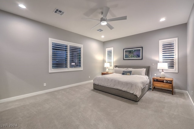 bedroom featuring ceiling fan and light colored carpet