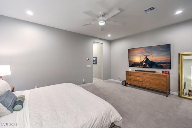 bedroom featuring ceiling fan and light carpet