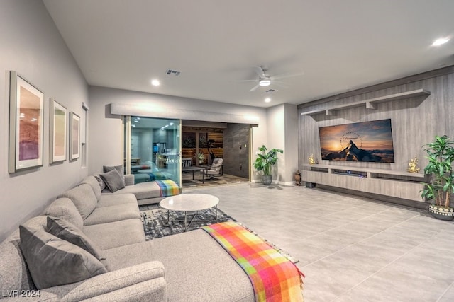 tiled living room featuring ceiling fan