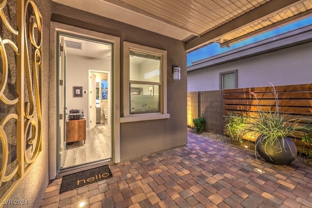 entrance to property with a patio area