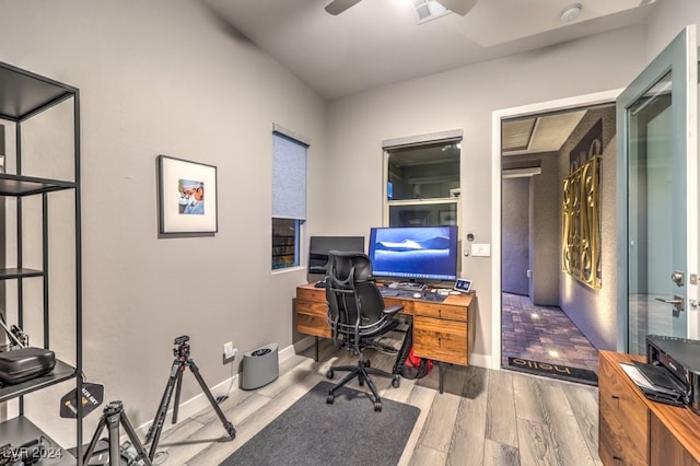 office space with ceiling fan and light wood-type flooring