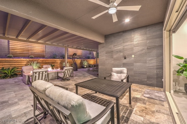 view of patio with outdoor lounge area and ceiling fan