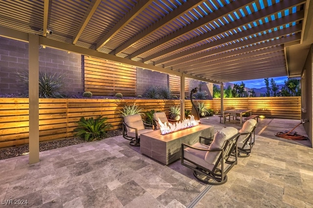 view of patio terrace at dusk