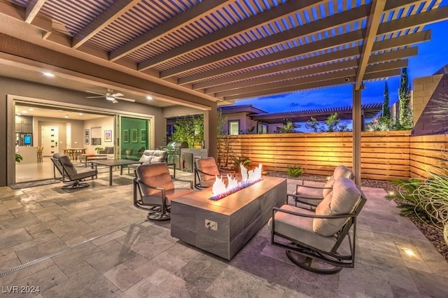 patio at twilight with ceiling fan, an outdoor living space with a fire pit, and a pergola