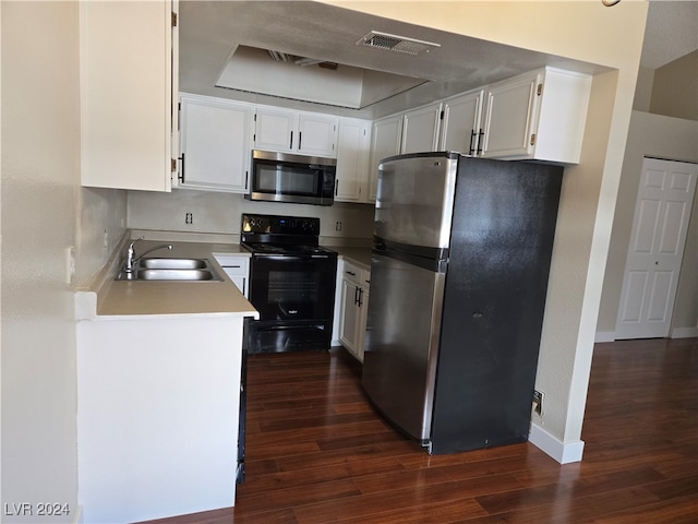 kitchen featuring white cabinets, stainless steel appliances, dark hardwood / wood-style floors, and sink