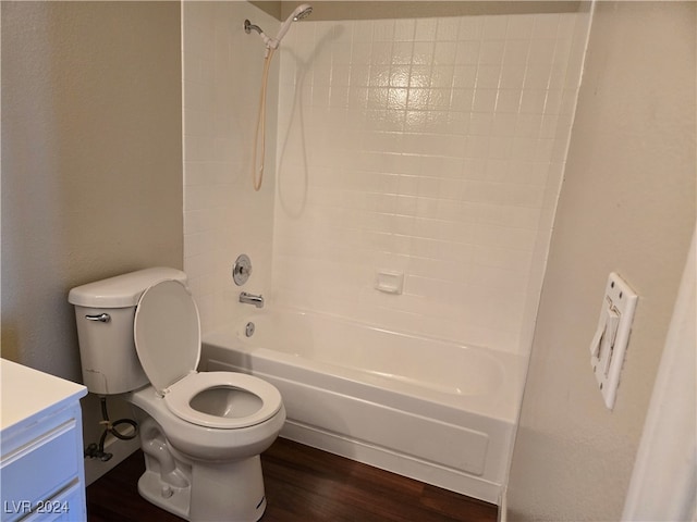 full bathroom with shower / washtub combination, hardwood / wood-style floors, vanity, and toilet