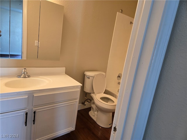 full bathroom with vanity, shower / bath combination, hardwood / wood-style floors, and toilet