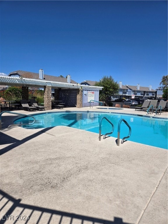 view of swimming pool featuring a patio area