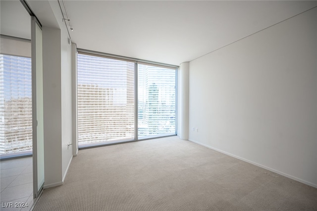 3726 Las Vegas Blvd Unit 2604, Las Vegas, NV 89158 - unfurnished room featuring floor to ceiling windows and light colored carpet