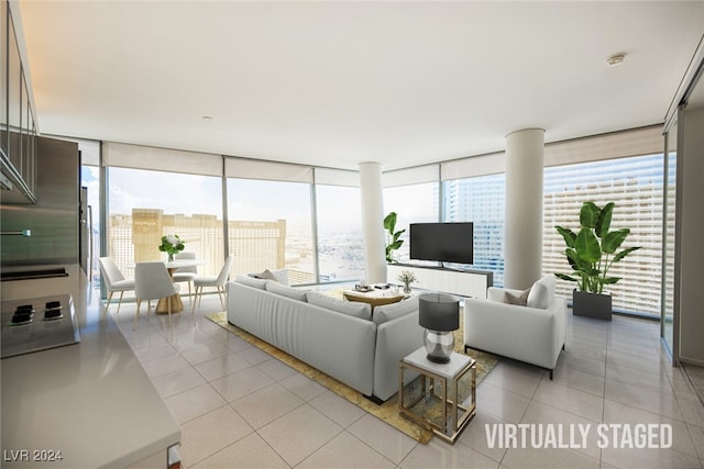 living room with expansive windows, light tile patterned floors, and a healthy amount of sunlight