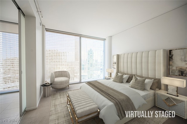 carpeted bedroom featuring a wall of windows and multiple windows