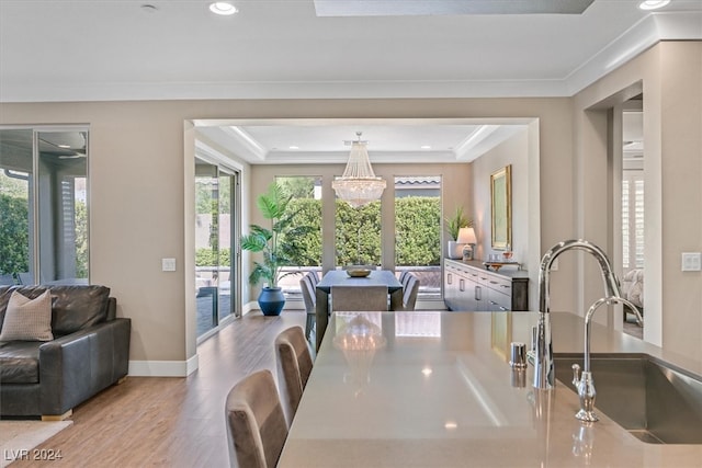 dining room featuring light hardwood / wood-style floors, a chandelier, and plenty of natural light