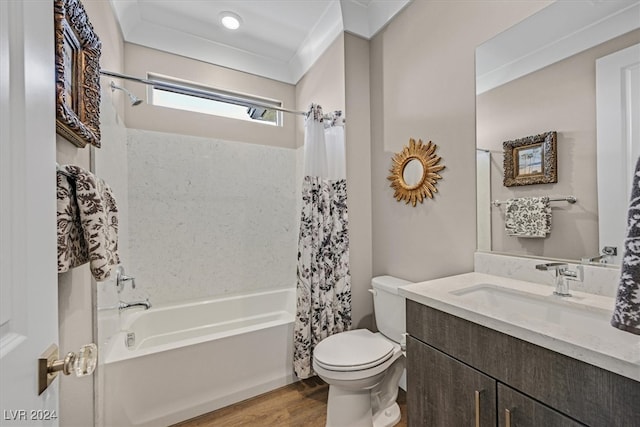 full bathroom with shower / bath combo with shower curtain, vanity, hardwood / wood-style flooring, ornamental molding, and toilet