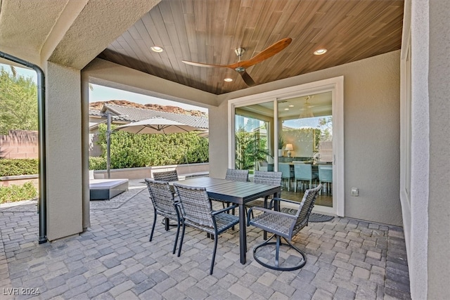 view of patio featuring ceiling fan