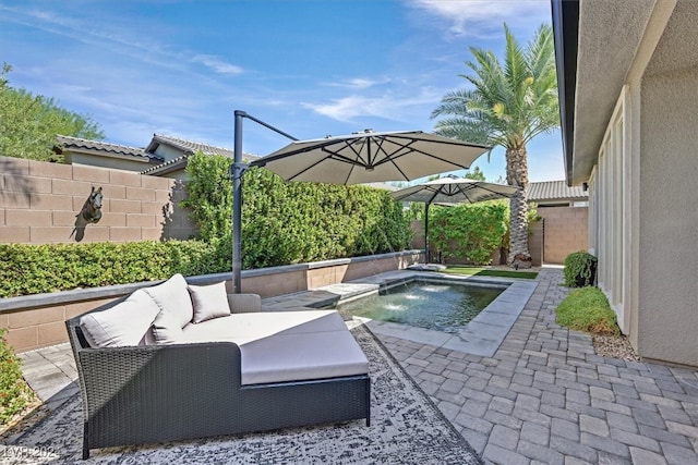 view of patio featuring outdoor lounge area, a fenced in pool, and pool water feature