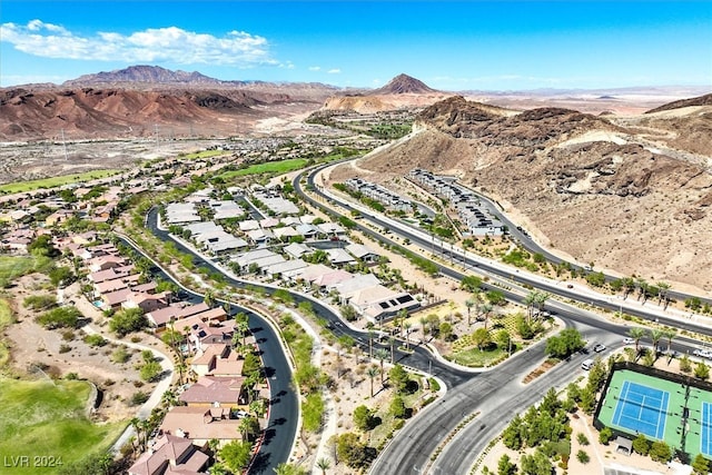 birds eye view of property featuring a mountain view