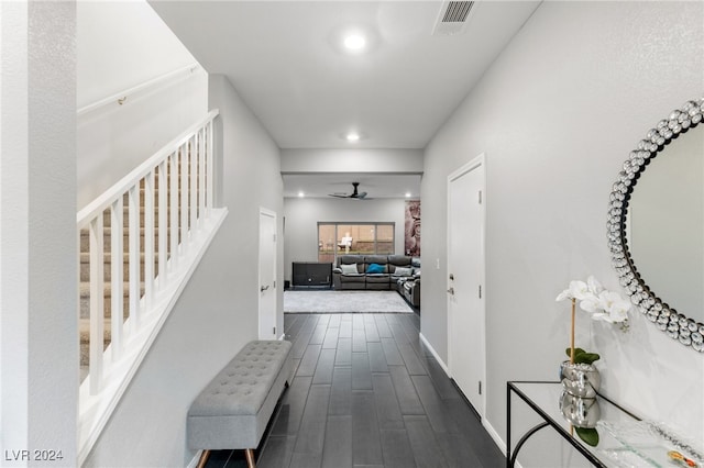 corridor with dark hardwood / wood-style flooring