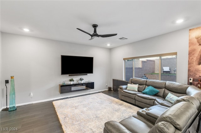 living room with ceiling fan and dark hardwood / wood-style floors