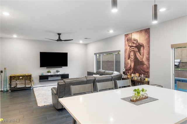 interior space with ceiling fan and dark wood-type flooring