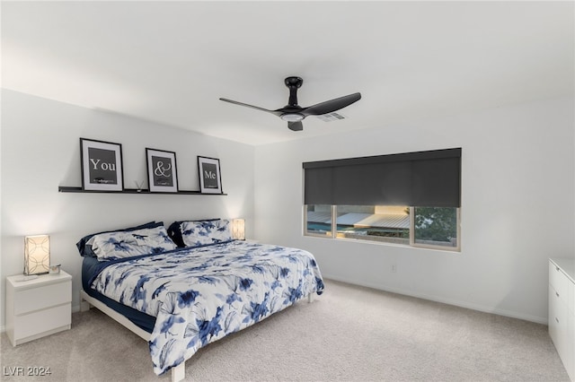 bedroom featuring ceiling fan and light colored carpet