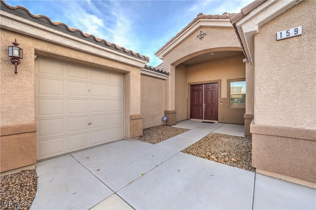 entrance to property featuring a garage