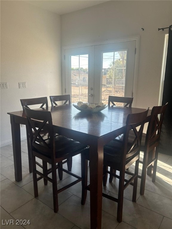 1840 Princeton St, North Las Vegas, NV 89030 - dining room with tile patterned flooring and french doors
