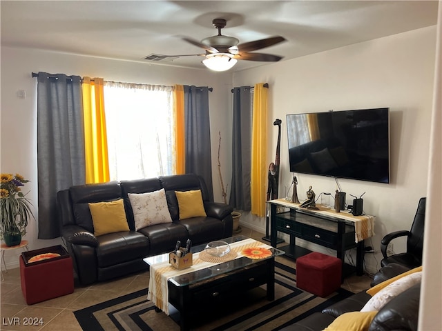 tiled living room featuring ceiling fan