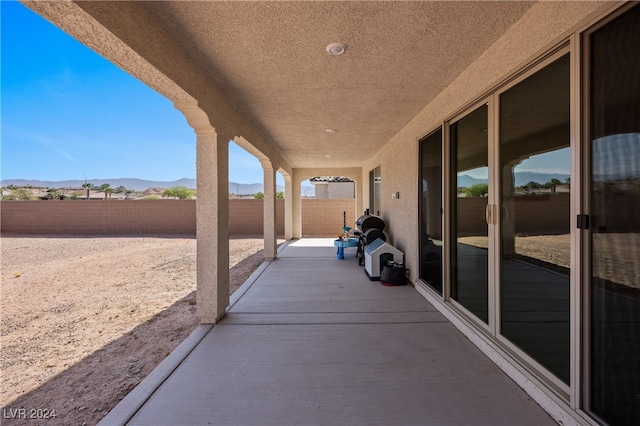 view of patio with a mountain view