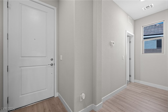 corridor featuring light hardwood / wood-style flooring