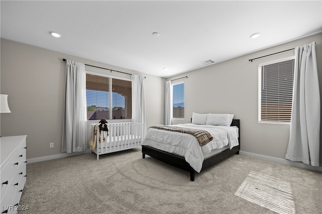 carpeted bedroom with radiator heating unit