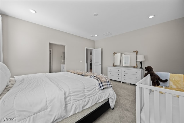 bedroom featuring light colored carpet