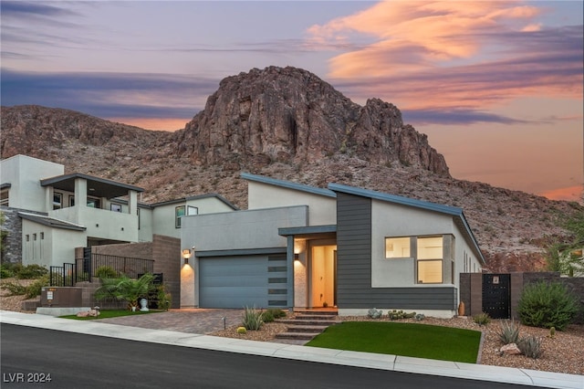 contemporary house with a garage and a mountain view