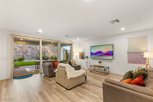 living room with light hardwood / wood-style flooring