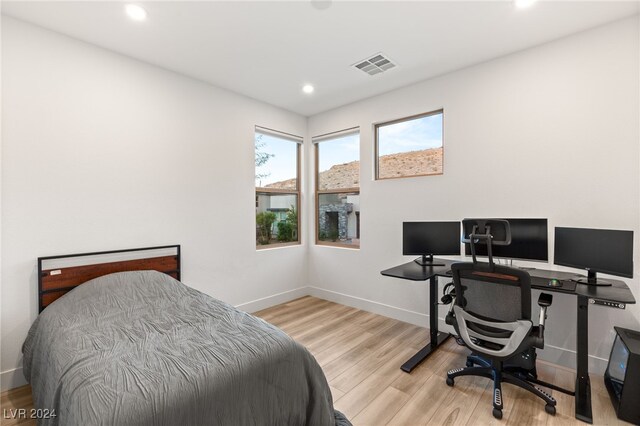 bedroom with light hardwood / wood-style floors