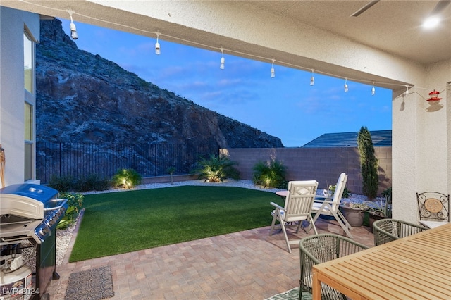 view of patio featuring a mountain view and grilling area