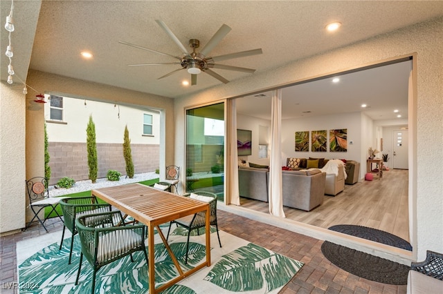 sunroom / solarium with ceiling fan