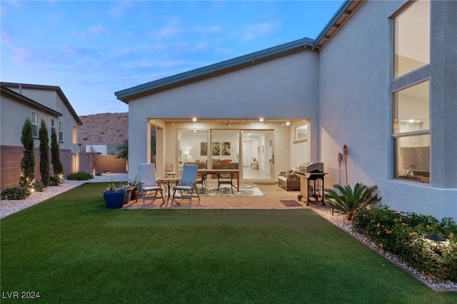 exterior space with a lawn and a patio area