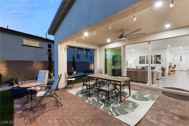 view of patio / terrace featuring ceiling fan