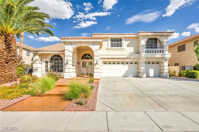 mediterranean / spanish house featuring a garage