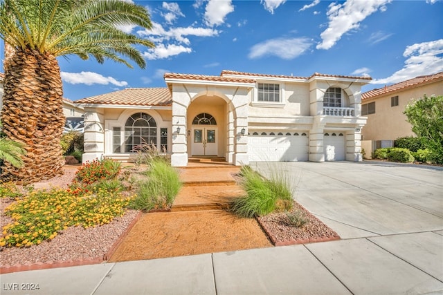 mediterranean / spanish house featuring a garage