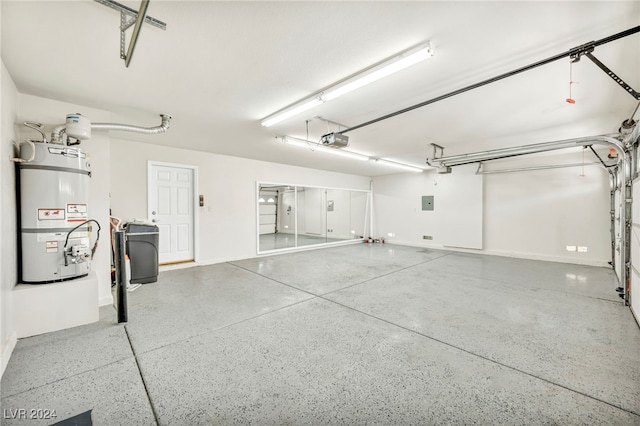 garage with a garage door opener, electric panel, and water heater