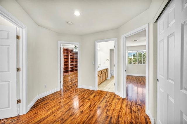 hall with light hardwood / wood-style floors