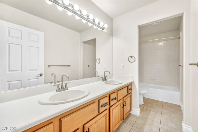 full bathroom with vanity, toilet, tiled shower / bath combo, and tile patterned flooring