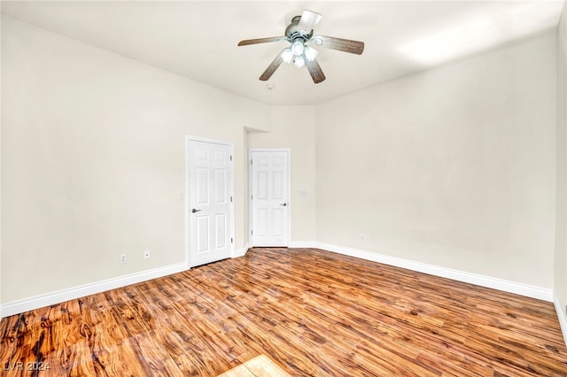 unfurnished room with ceiling fan and light wood-type flooring