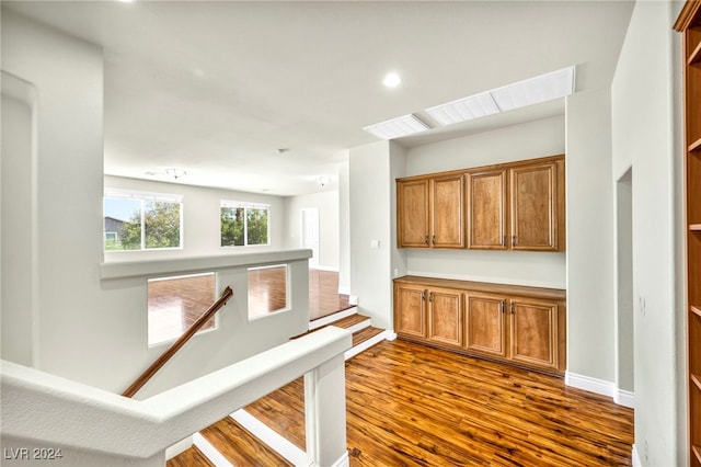 hall with dark hardwood / wood-style floors