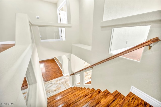 staircase featuring hardwood / wood-style floors