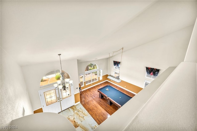 living room with a notable chandelier and hardwood / wood-style flooring