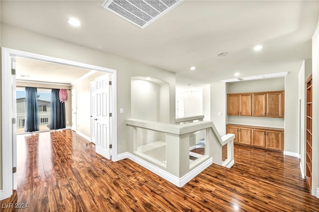 corridor featuring dark hardwood / wood-style flooring