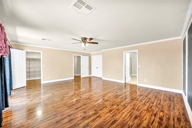 spare room featuring hardwood / wood-style flooring, ornamental molding, and ceiling fan