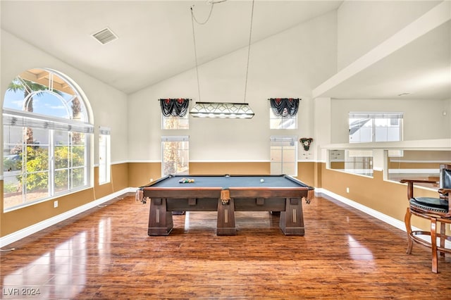 game room with a healthy amount of sunlight, wood-type flooring, high vaulted ceiling, and billiards